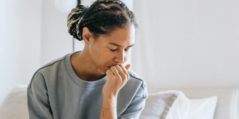 Woman looking sad with title 'how to make mistakes as a perfectionist'