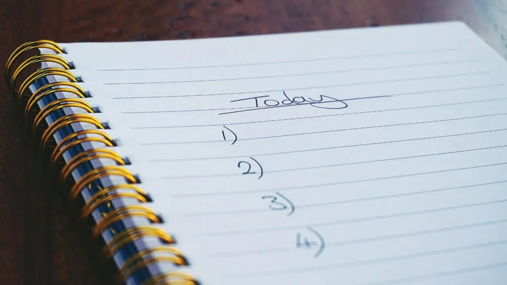 a notebook with the words 'today' followed by a list of numbers 1-4 to create a mindful action plan