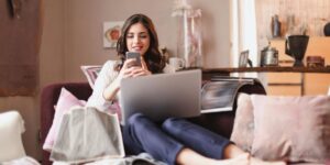 Woman Using Smartphone While Lying on Couch - stop social media draining energy