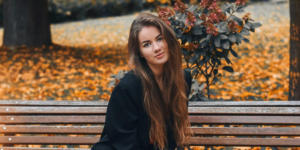 Woman Wearing Black Blazer Sitting on Wooden Bench for september journal prompts for hope