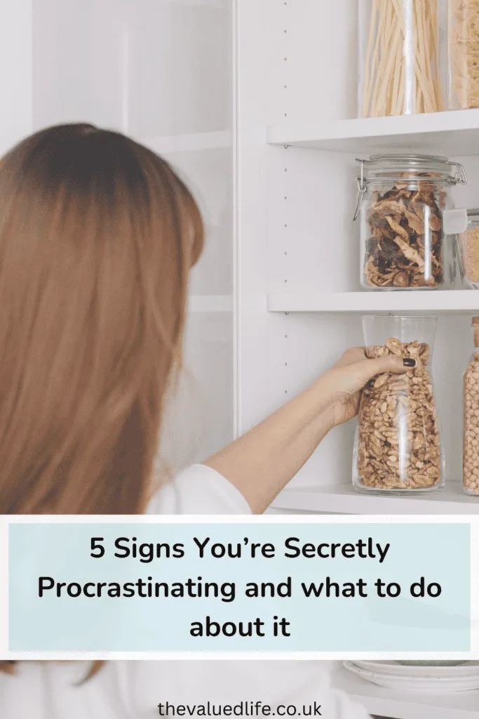A woman organizing glass jars filled with dry goods in a kitchen pantry, symbolizing productive activities that may disguise secretly procrastinating behaviors. Perfectly arranged shelves suggest a focus on minor tasks over meaningful progress.