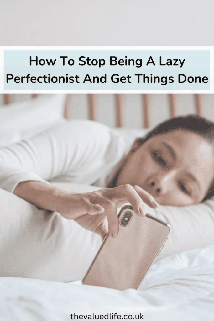 Person lying in bed with their phone, accompanied by text overlay 'How To Stop Being A Lazy Perfectionist And Get Things Done,' illustrating procrastination linked to lazy perfectionism.