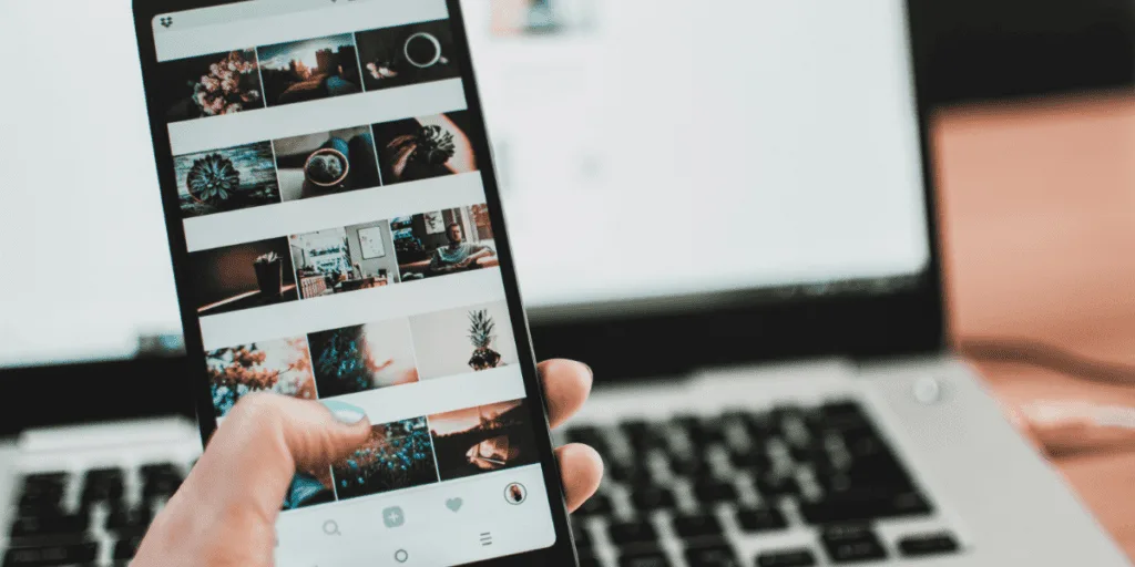 Person scrolling through images on a smartphone, visually representing the distraction and delay associated with procrastination.