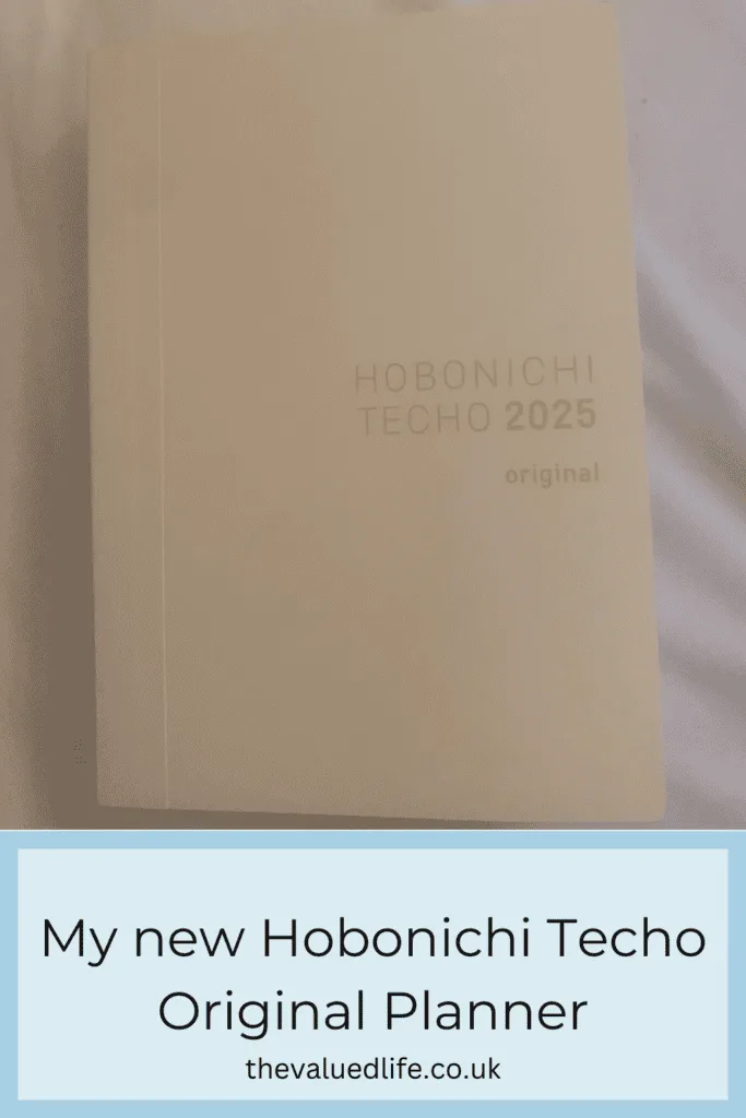 A 2025 Hobonichi Techo Original Planner in a minimalist cream cover, showcasing its sleek and simple design.